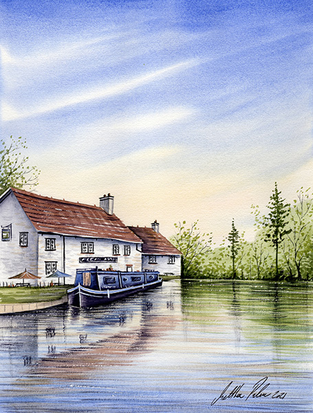 Springtime canal with narrowboat and pub